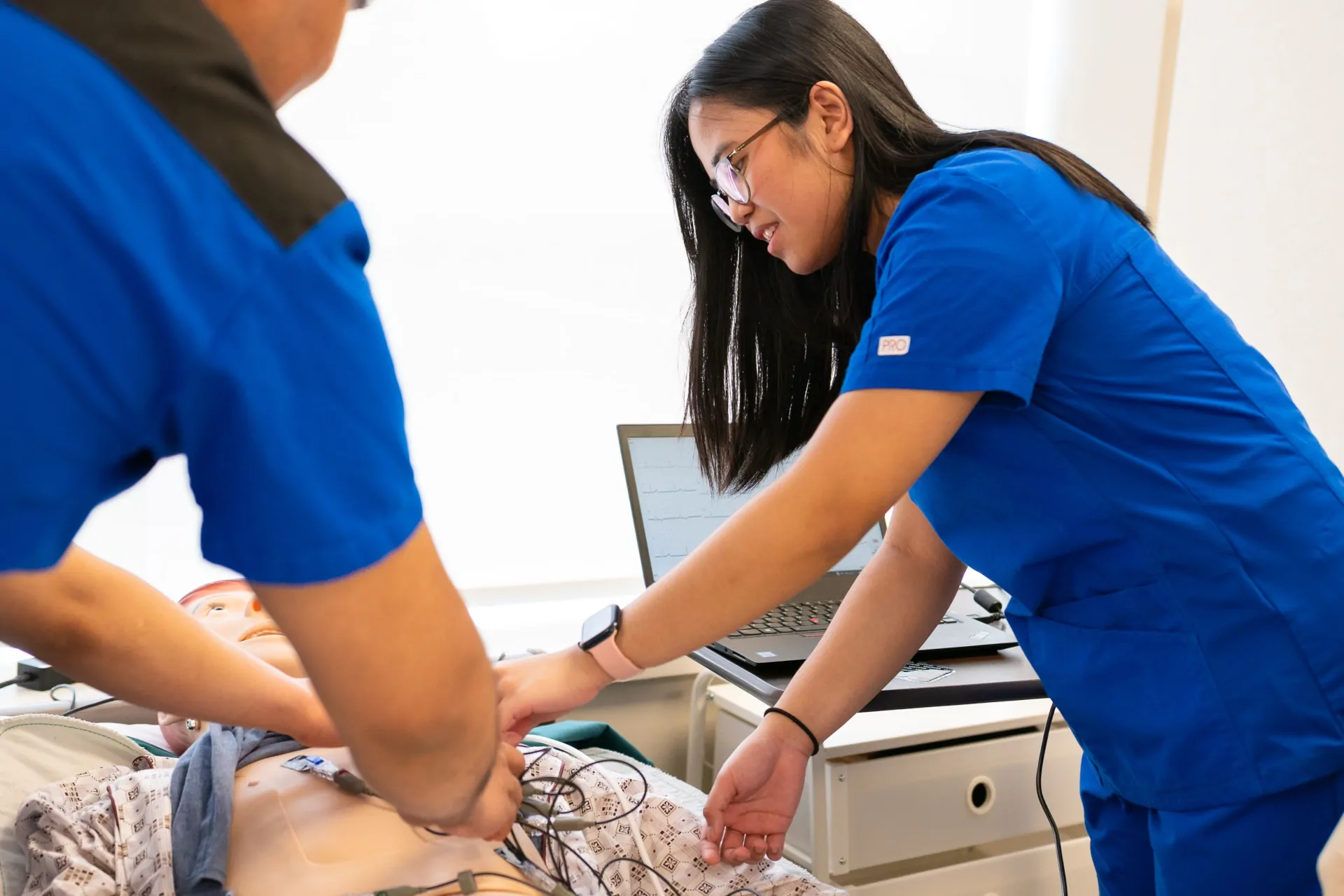 Nursing student caring for patient